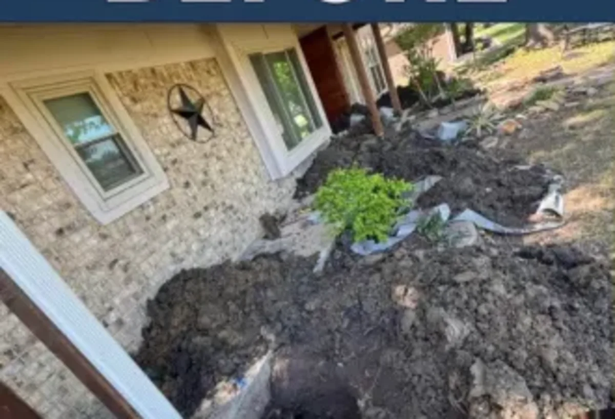Brick two story home with the soil dug out along the foundation before piers were installed